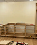 Cabinets supported by adjustable leveler feet 3.9 to 5 inches, 12 pack black plastic furniture levelers, in unfinished kitchen setup.