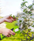Heavy Duty Cordless Electric Pruning Shears With 6 Foot Extension Pole And Rechargeable Battery For Slicing Through Roses And Tough Branches in use, cutting a branch.