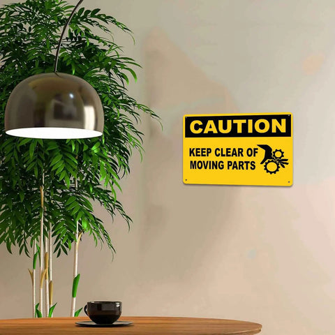 Caution Keep Clear Of Moving Parts 8 By 12 Inch Aluminum Sign on wall in indoor setting