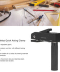 Desktop Quick Acting Holdfast Clamp Woodworking Bench Station With Hella Strong Grip Three Gear Locking System Router Hold Down Clip Solid Heavy Duty Build 20mm next to drafting tools, showcasing aluminum alloy and grip.
