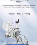 Fully Automatic Compact Labeling Machine With Conveyor Belt Self Adhesive Applicator For Round Bottles Boxes Bags Photoelectric Sensor Hustle Ready Heavy Lifter, side view showing labeling mechanism.