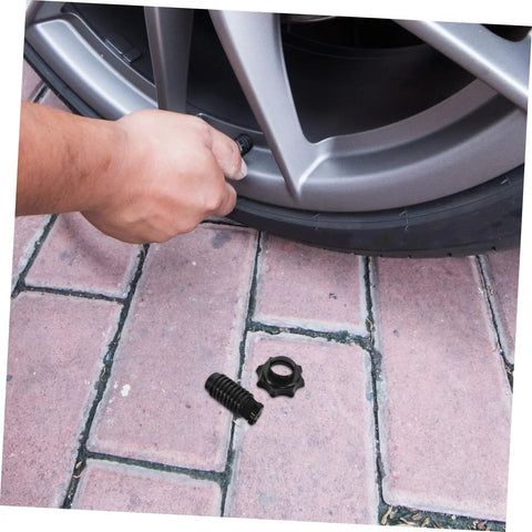 Hand using spare tire mounting bolt kit for cars easy install no fuss hold down screw clamp tire tightener bolt