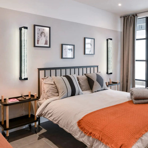 Modern bedroom with Crystal Bubble Glass Wall Sconce LED Light Fixture Black, illuminating each side of a bed.