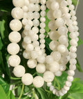 Legit Premium Natural White Pearl Shell Beads For Diy Jewelry Making With Awesome Iridescent Glow And Smooth Round Edges, various sizes on display.
