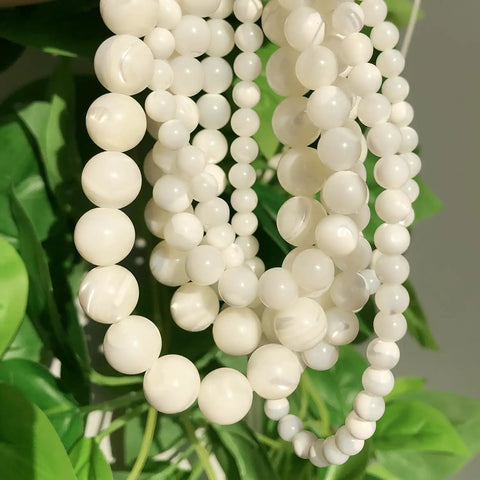 Legit Premium Natural White Pearl Shell Beads For Diy Jewelry Making With Awesome Iridescent Glow And Smooth Round Edges, various sizes on display.