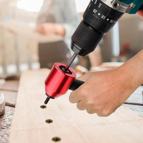 Heavy Duty Rivet Nut Tool Kit Compatible With Electric Drill And Ratchet Wrench being used on wood with rivets.