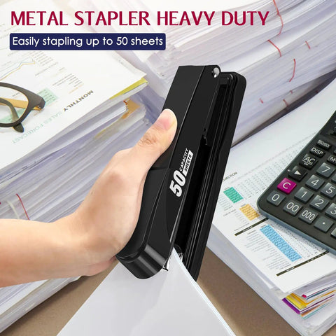 Hand using Beefy Heavy Duty Metal Stapler 50 Sheet Capacity With 1750 Staples And Stapler Remover Full Strip Desk Stapler No Jam Non Slip For Office And Classroom Black on desk stack.