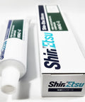 Front view: Shin-Etsu HIVAC-G silicone grease tube (3.5 oz/100 g) with green label and branded white box.