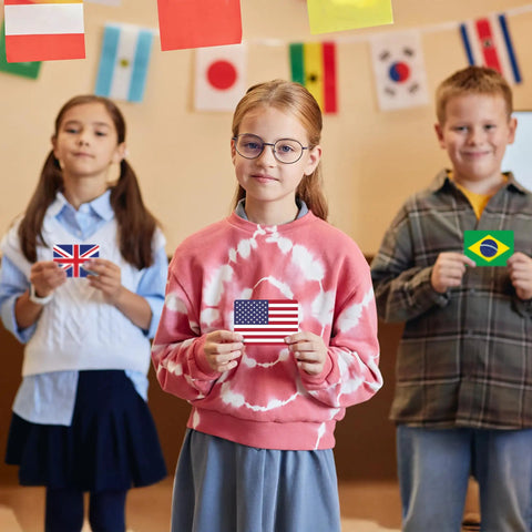 Children holding flags from World Flags Flashcards Set With 245 Countries, Geography Game With World Map showing USA, UK, Brazil.