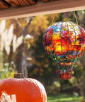 Colorful stained glass hot air balloon sunlight catcher hanging outdoors