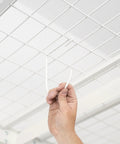 Hand installing Heavy Duty Overhead Storage Rack And Wall Mount Hooks Four Pack Steel Hooks for bikes and gear.