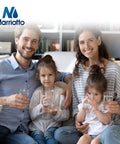 Family of four smiling, holding glasses of clean water, with Marrio water filter logo visible, representing purified drinking water.