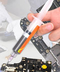 Person using lead free solder flux paste for precise electronics and PCB repair in industrial workshop setting.