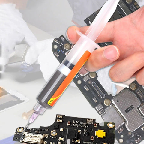 Person using lead free solder flux paste for precise electronics and PCB repair in industrial workshop setting.