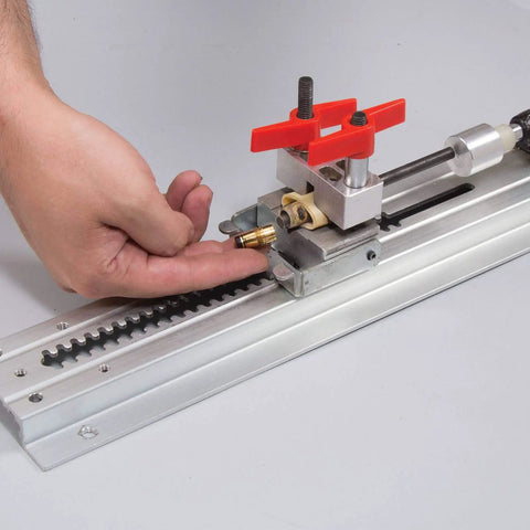 Hand demonstrating the adjustable sled and handle on Pen Press XL For Assembly And Disassembly, suitable for pen making projects.