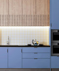 Contemporary kitchen with wooden upper cabinets and sleek concealed handles for drawers showcasing modern design.