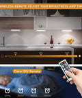 USB Rechargeable Motion Sensor Closet Light 3 Pack With Remote Dimmable Under Cabinet LED Light Bar Stick Anywhere Night Light For Wardrobe And Kitchen No Hub Required Easy Install over a kitchen counter with remote control.