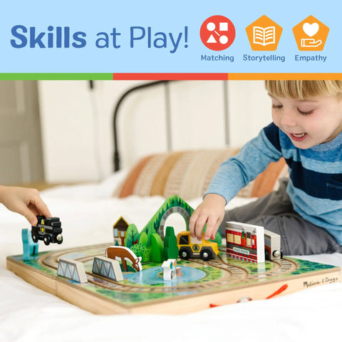 Child playing with Portable Wooden Railroad Tabletop Playset With Magnetic Train Cars And Animal Scenery For Toddlers And Preschoolers Age Three Plus Legit Awesome Travel Kit.