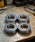 High Precision 15x26x7mm Double Sealed Ball Bearing on a workbench, chrome steel build for skates and scooters.