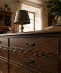 Close-up of Vintage Oil Rubbed Bronze Bail Drawer Pulls Set Of 6 on a wooden dresser in a rustic interior setting