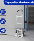 Aluminum Hand Truck Dolly With 9.84 Inch Pneumatic Tires Heavy Duty 500 Lb Capacity Platform Cart shown in warehouse