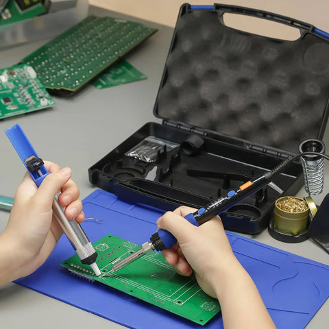 Hands using 65W Digital Soldering Iron Kit With Precise Temperature Control From 194 To 896 Fahrenheit And Celsius Display on circuit board