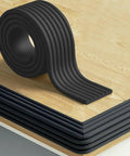 Thick W Shape Baby Proofing Edge Protectors Soft Foam Corner Guards resting on a wood table, showing the black residue free strip.