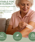 Elderly woman applying Silicone Adhesive Bandages For Fragile Skin 2x4 Inch XL Pack Of 20 on arm, highlighting gentle removal.