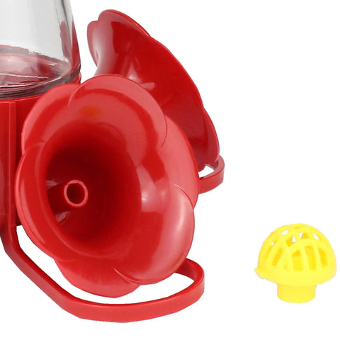 Replacement Bee Guards For Hummingbird Feeders 205Y Yellow 4 Pack, shown next to red feeder part.