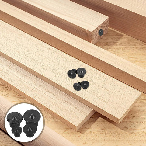 8 Piece Woodworking Dowel Pin Locator Kit with metal center transfer plugs on wooden boards for precise holes.