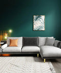 Adjustable Gold Furniture Legs For Desks, Cabinets, Beds And Couches, 12.5 Cm 5 In High, visible on a modern grey couch in a stylish room.