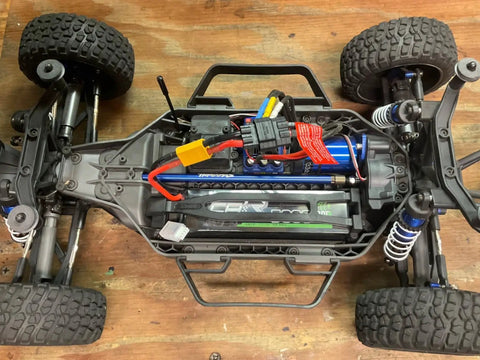 RC car chassis with 3S LiPo Battery 11.1V 5200mAh 120C With XT60 And TRX Plugs, visible wiring and suspension