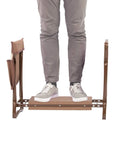 Person standing on 2 In 1 Garden Kneeler And Bench Folding Stool With Tool Pouches And Soft EVA Foam Cushions, durable brown frame