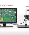 Top Shelf Black C Mount Monocular Microscope Camera Adapter with 0.7X zoom, displayed with 22" LCD monitor.