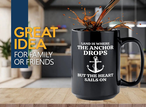 Fifteen Ounce Black Coffee Mug For Lake Lovers And Boat Captains With Land Is Where Theme Funny Boating Gift For Boaters Sailors Lake Life Fans And Outdoor Enthusiasts on a kitchen counter with coffee splash.