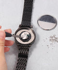 Straight Up Premium Watch Battery Clamp Screws Assortment Kit Hella Sturdy Stainless Steel Hardware No Hassle Essential For Precision Watchmaker Repairs And Dial Fixes being used to secure watch battery.