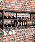 Industrial Wall Mounted Wine Rack With Stemware Holders Two Tier Iron Bar Shelf Bottle Display For Home Kitchen Decor, black steel frame with wine bottles and glasses.