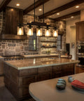 Five Light Farmhouse Dining Room Chandelier Over Table In Matte Black With Rustic Wood Accents And Clear Glass Shades in kitchen