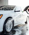 Pressure Washer Short Gun Foam Cannon Kit With One Quarter Inch Quick Connector And Five Nozzle Tips M22 To Fourteen Millimeter Inlet Adapter Up To Two Thousand PSI For Cars Driveways And Patios being used to wash a car.