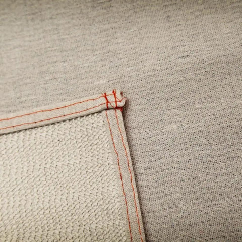 Close-up of Stay Put Canvas Plus Drop Cloth 6 Ft By 8 Ft Ultra Slip Resistant Backing showing stitching and texture details.