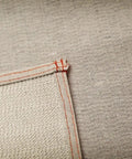 Close-up of Stay Put Canvas Plus Drop Cloth seam showing 3-layer absorbent canvas with slip-resistant backing, 9 ft by 12 ft.