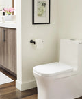 Matte Black Single Post Toilet Paper Holder Seven And A Quarter Inch Arrondi Bath Tissue Holder in modern bathroom
