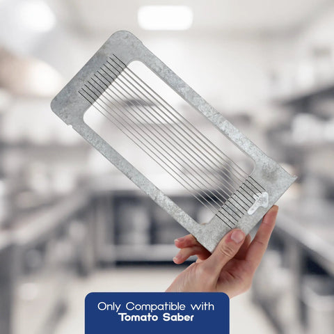 Hand holding 3/16 Inch Blade Cartridge For Tomato Saber Replacement Cutter And Vegetable Chopper Blade in a commercial kitchen.