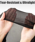 Hands holding tear-resistant HMPE ripstop fabric of Ultralight Pocket Hammock For Solo Adventures, showcasing ultralight and compact material.