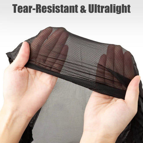 Hands holding tear-resistant HMPE ripstop fabric of Ultralight Pocket Hammock For Solo Adventures, showcasing ultralight and compact material.