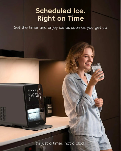 Woman using Countertop Nugget Ice Maker With 40 Lbs Per Day Capacity in kitchen with glass of pebble ice.
