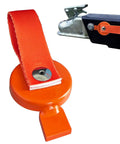 Close-up of magnetic surge brake lockout key with orange round head and red nylon strap