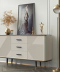 Modern sideboard with adjustable black cabinet pulls, abstract art, gold lamp, and decor in living room setting.