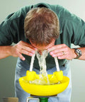 Person using Yellow Wall Mounted Emergency Eyewash Station With Dual Spray Heads And Hands Free Activation 15 Minute Flush
