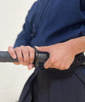 Person handling Polypropylene Short Katana Black Sword With Black Scabbard 23.5 Inch Overall Length 16 Inch Blade Martial Arts Practice